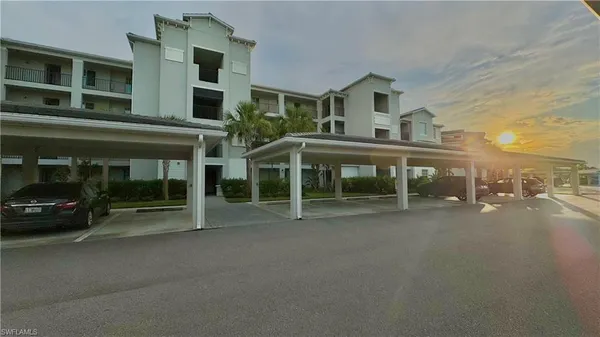 a view of a car park in front of house