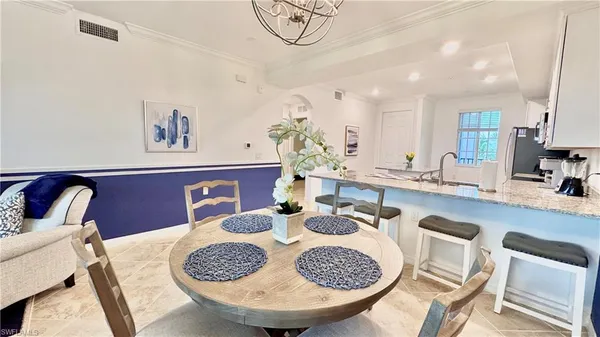 a dining room with furniture and a table