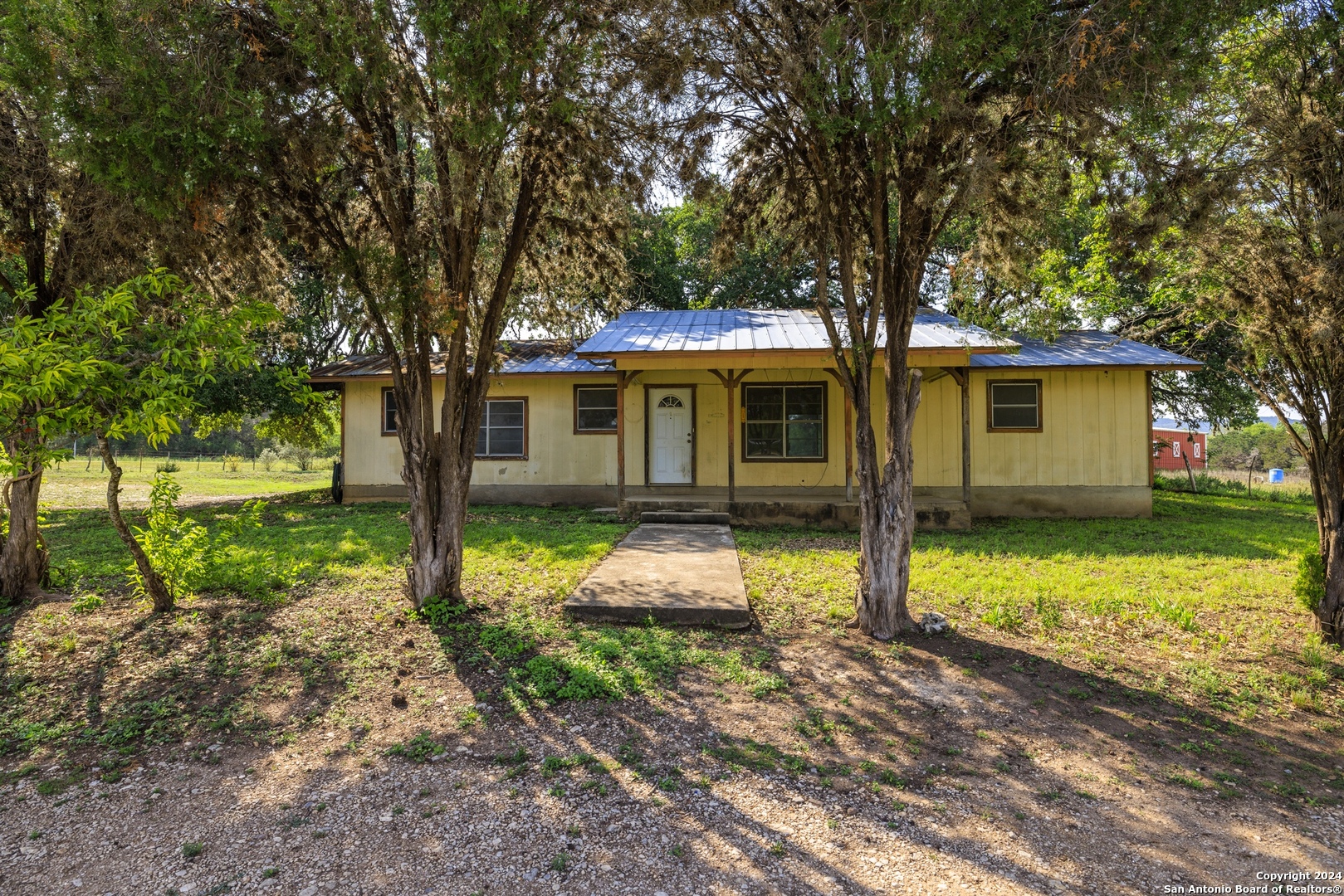 75 Rm 366 Leakey, TX 78873 - Photo 22 of 49 a front view of house with yard and green space