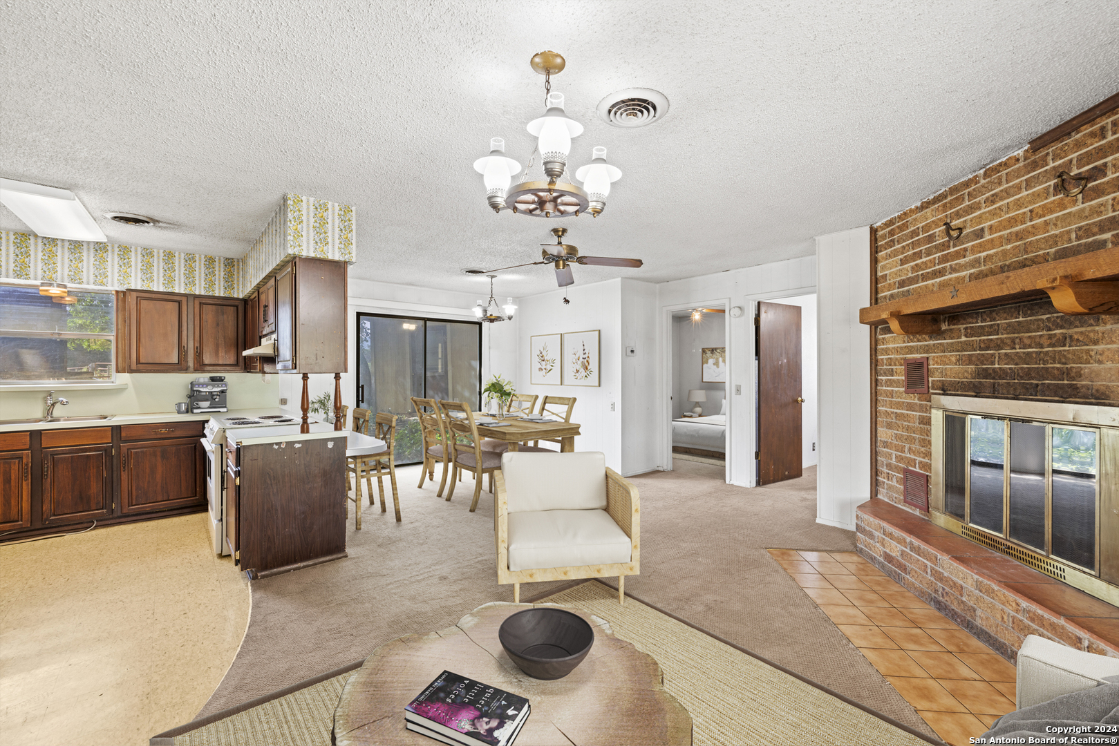 75 Rm 366 Leakey, TX 78873 - Photo 24 of 49 a living room with kitchen island furniture and a chandelier