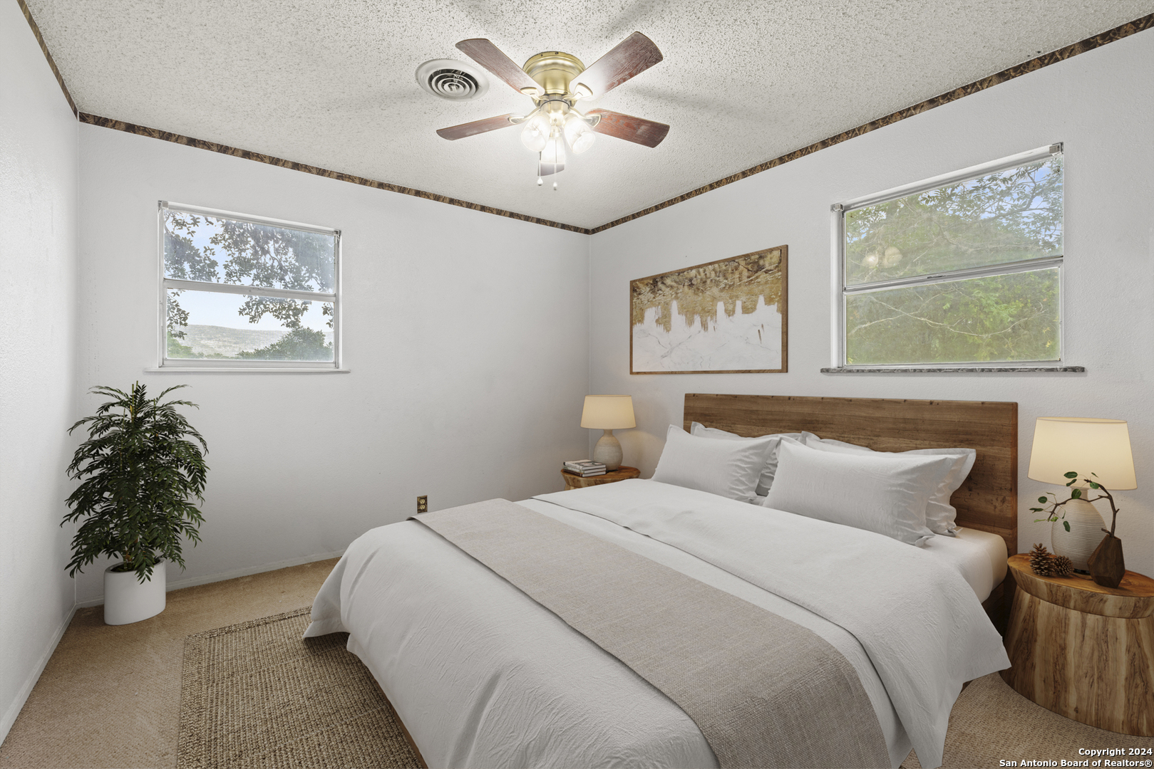 75 Rm 366 Leakey, TX 78873 - Photo 29 of 49 a bedroom with a bed and a painting on the wall