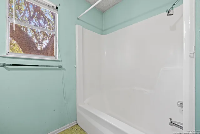 a view of house with yard and entertaining space