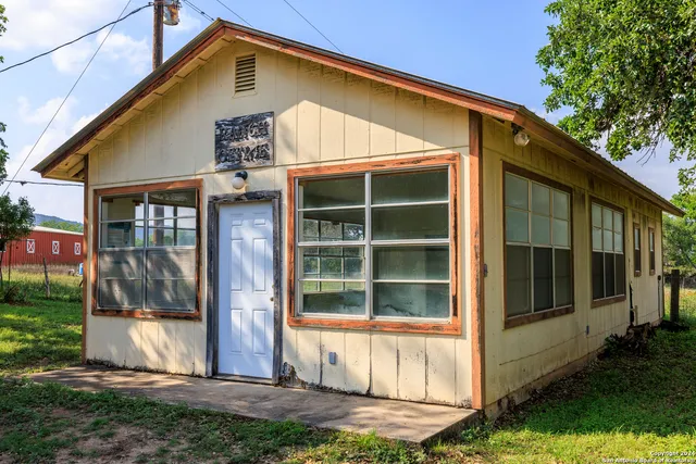a bathroom with a sink a mirror and a shower