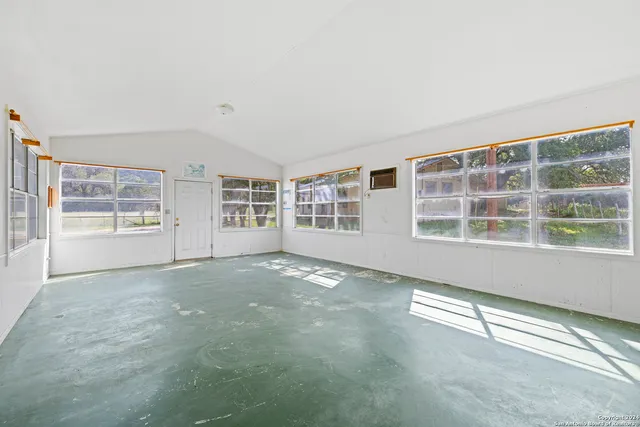 a view of a field with an ocean