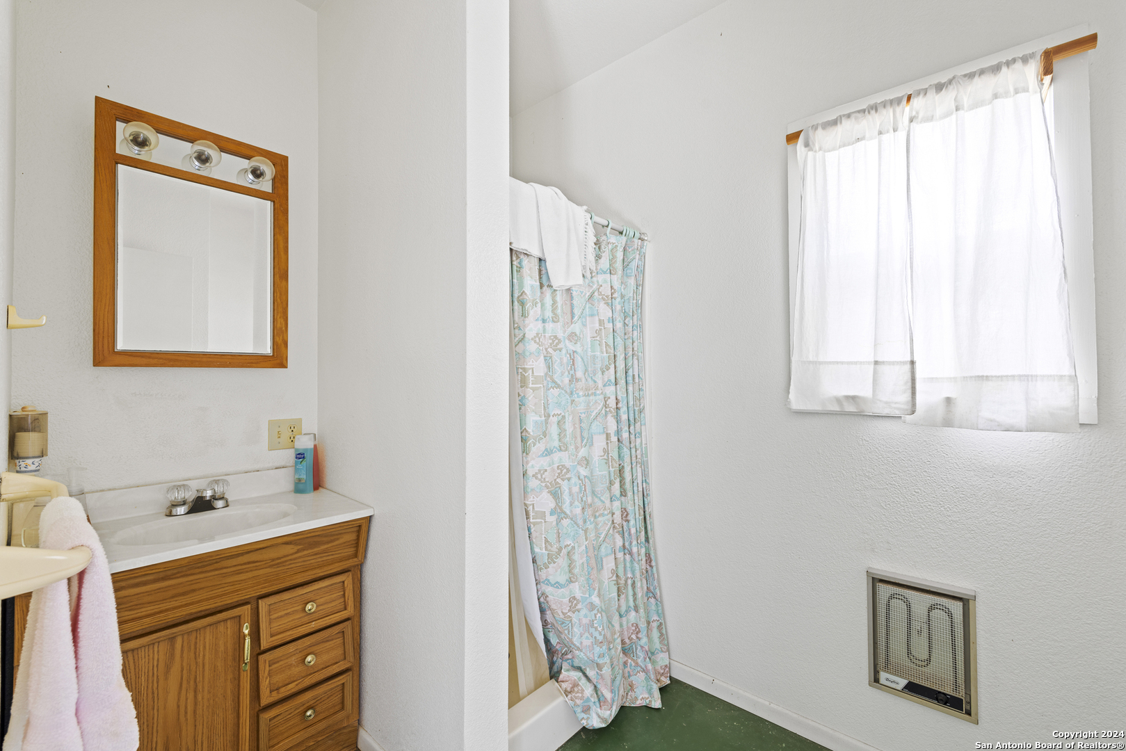 75 Rm 366 Leakey, TX 78873 - Photo 40 of 49 a bathroom with a sink a mirror and a shower
