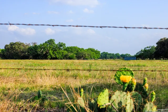 a view of a field with an outdoor space