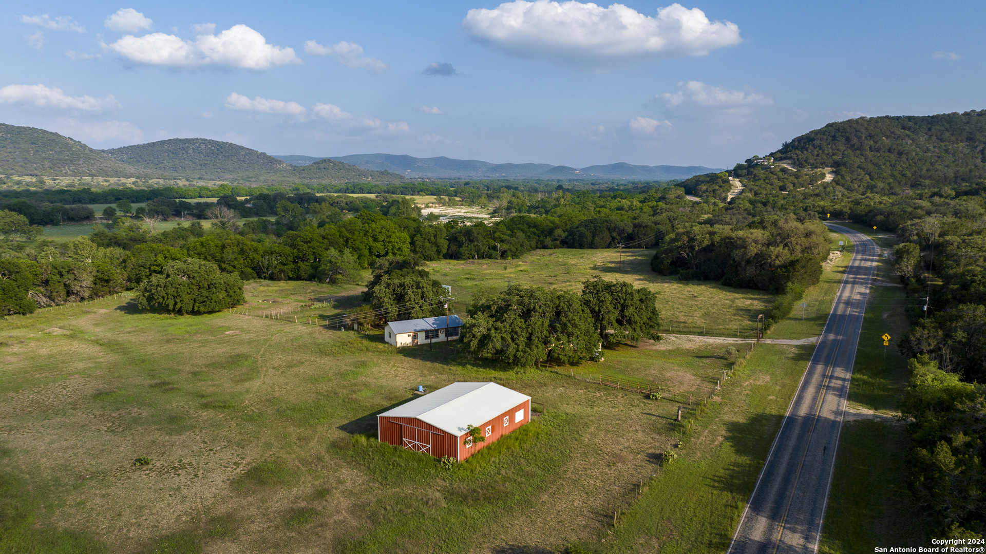 75 Rm 366 Leakey, TX 78873 - Photo 5 of 49 an aerial view of a house with outdoor space swimming pool and mountains