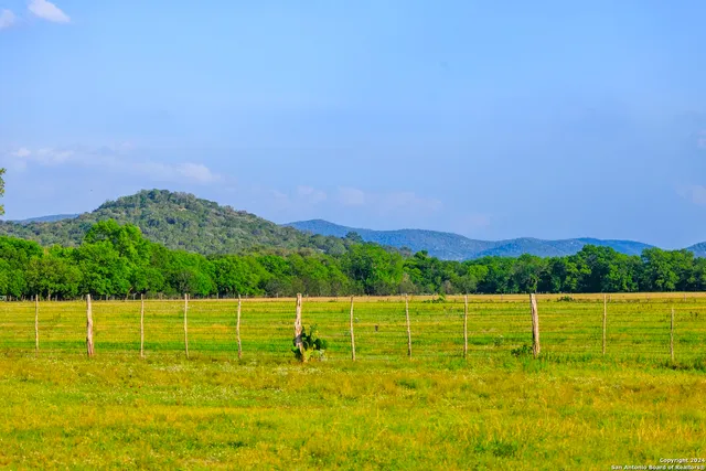 a view of an ocean and a mountain