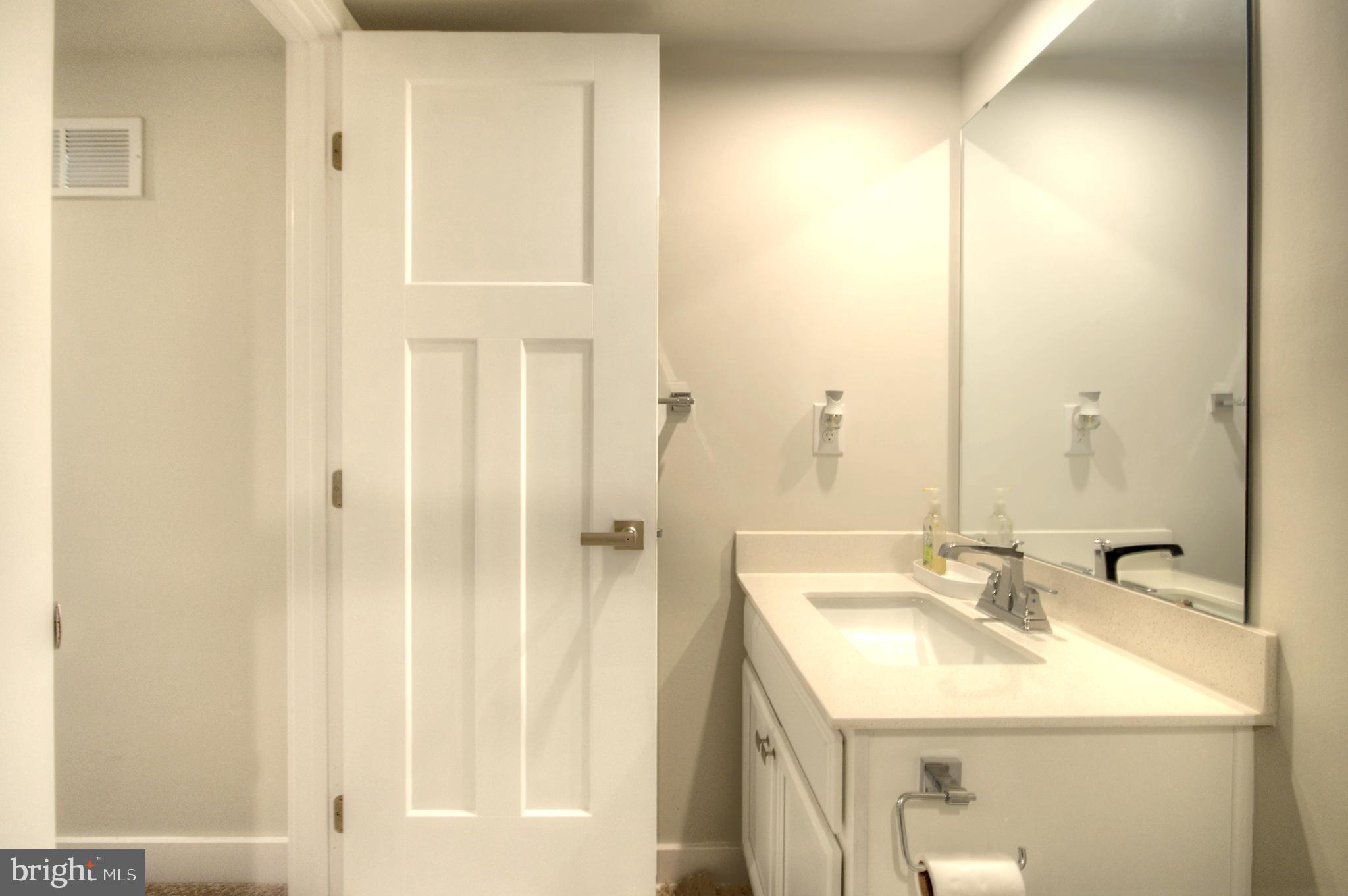 8 Eichmann Way Woodstown, NJ 08098 - Photo 20 of 47 a bathroom with a sink a mirror and a shower