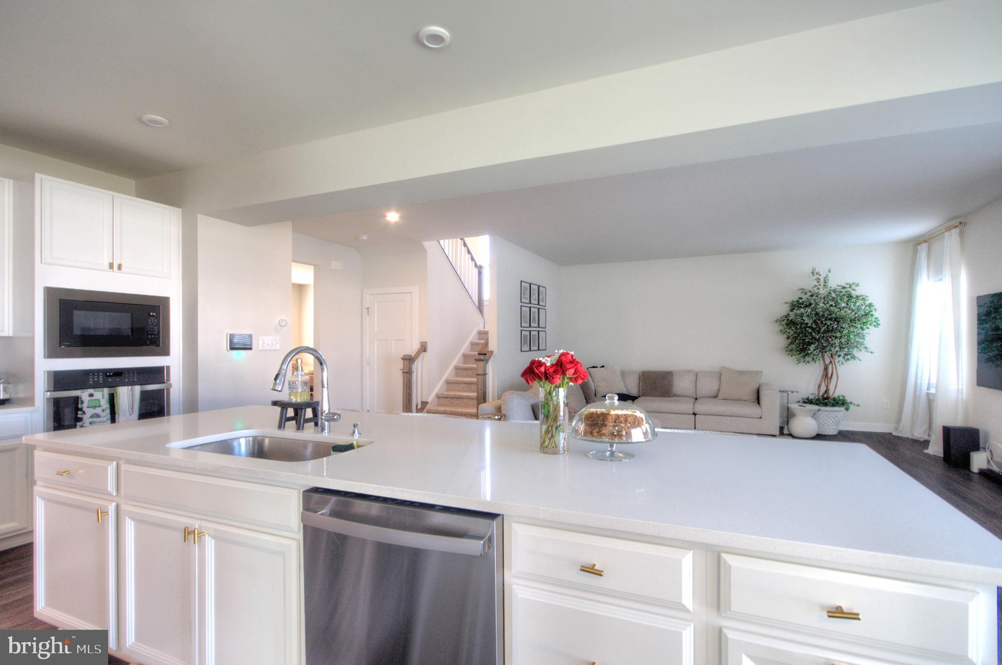 8 Eichmann Way Woodstown, NJ 08098 - Photo 6 of 47 a kitchen with a sink and potted plant