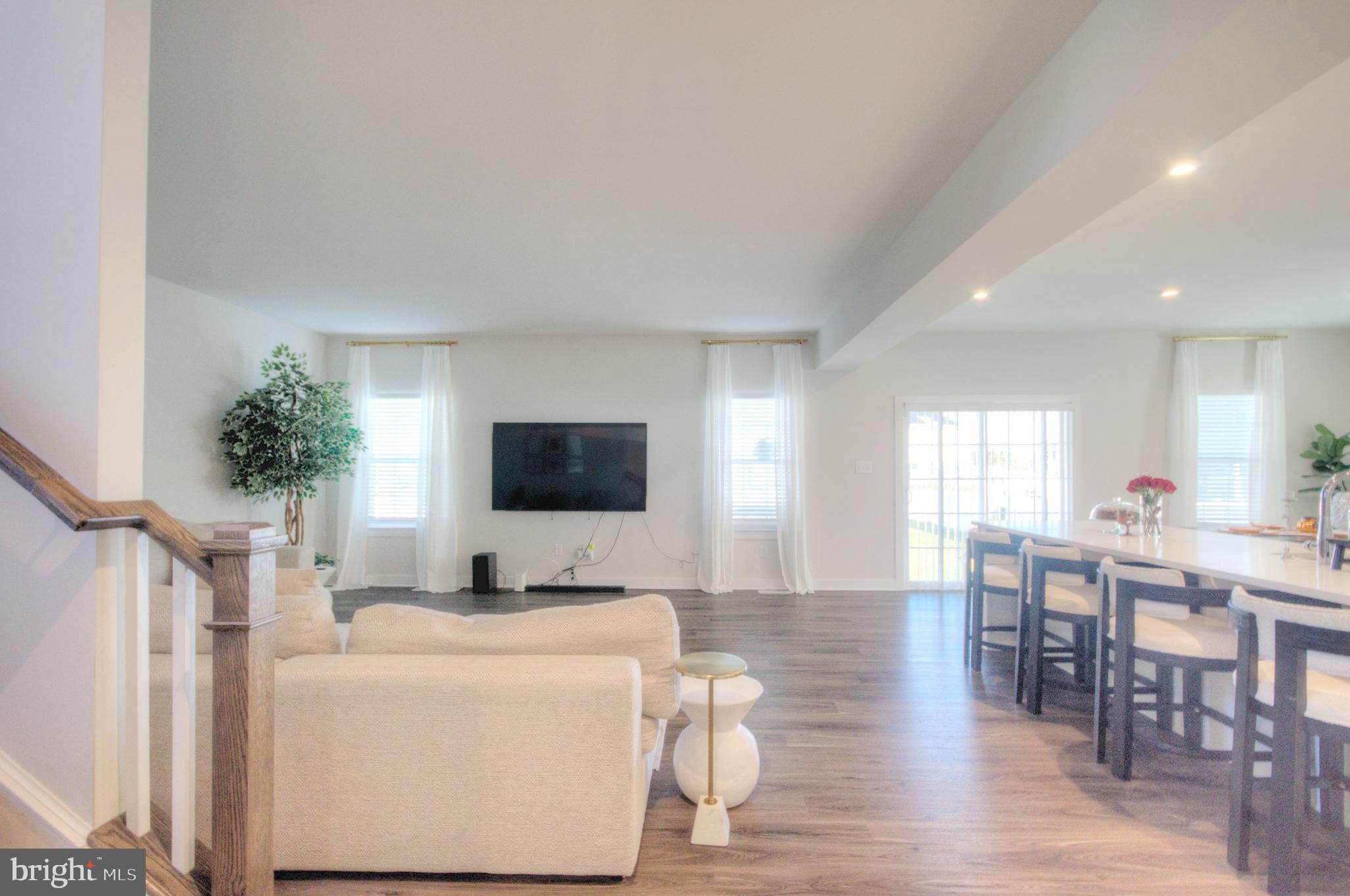 8 Eichmann Way Woodstown, NJ 08098 - Photo 7 of 47 a living room with furniture and a flat screen tv