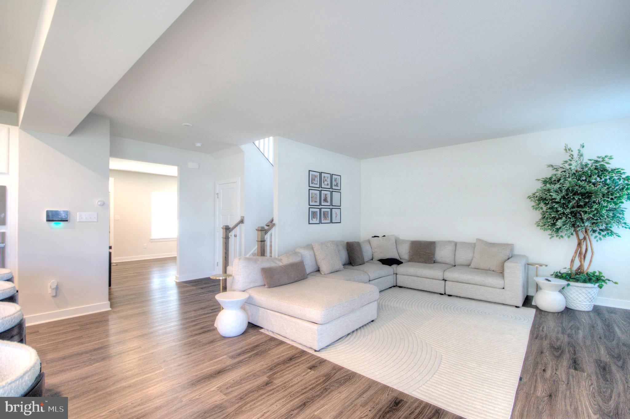 8 Eichmann Way Woodstown, NJ 08098 - Photo 8 of 47 a living room with furniture and wooden floor