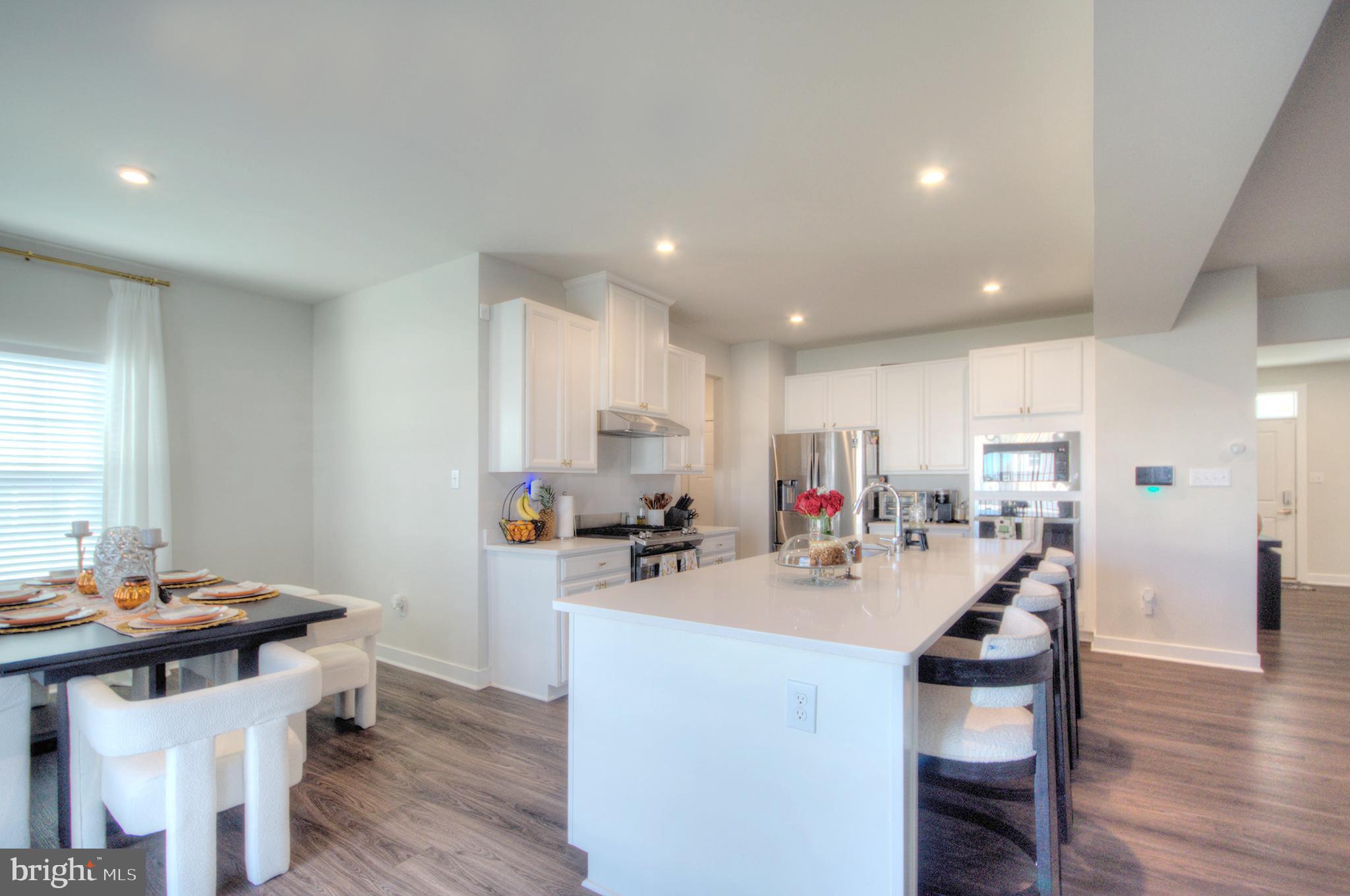8 Eichmann Way Woodstown, NJ 08098 - Photo 10 of 47 a view of a dining room with furniture and wooden floor