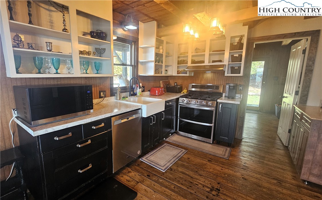 480 Schoolhouse Ridge Boone, NC 28607 - Photo 9 of 47 a kitchen with stainless steel appliances granite countertop a stove a sink and a refrigerator
