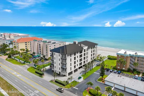 a view of a balcony with an ocean view
