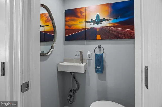 a bathroom with a sink and mirror