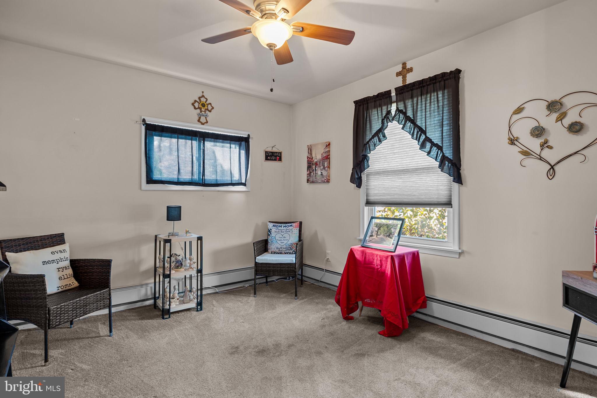 179 Crabtree Drive Levittown, PA 19055 - Photo 17 of 25 a living room with furniture and a ceiling fan