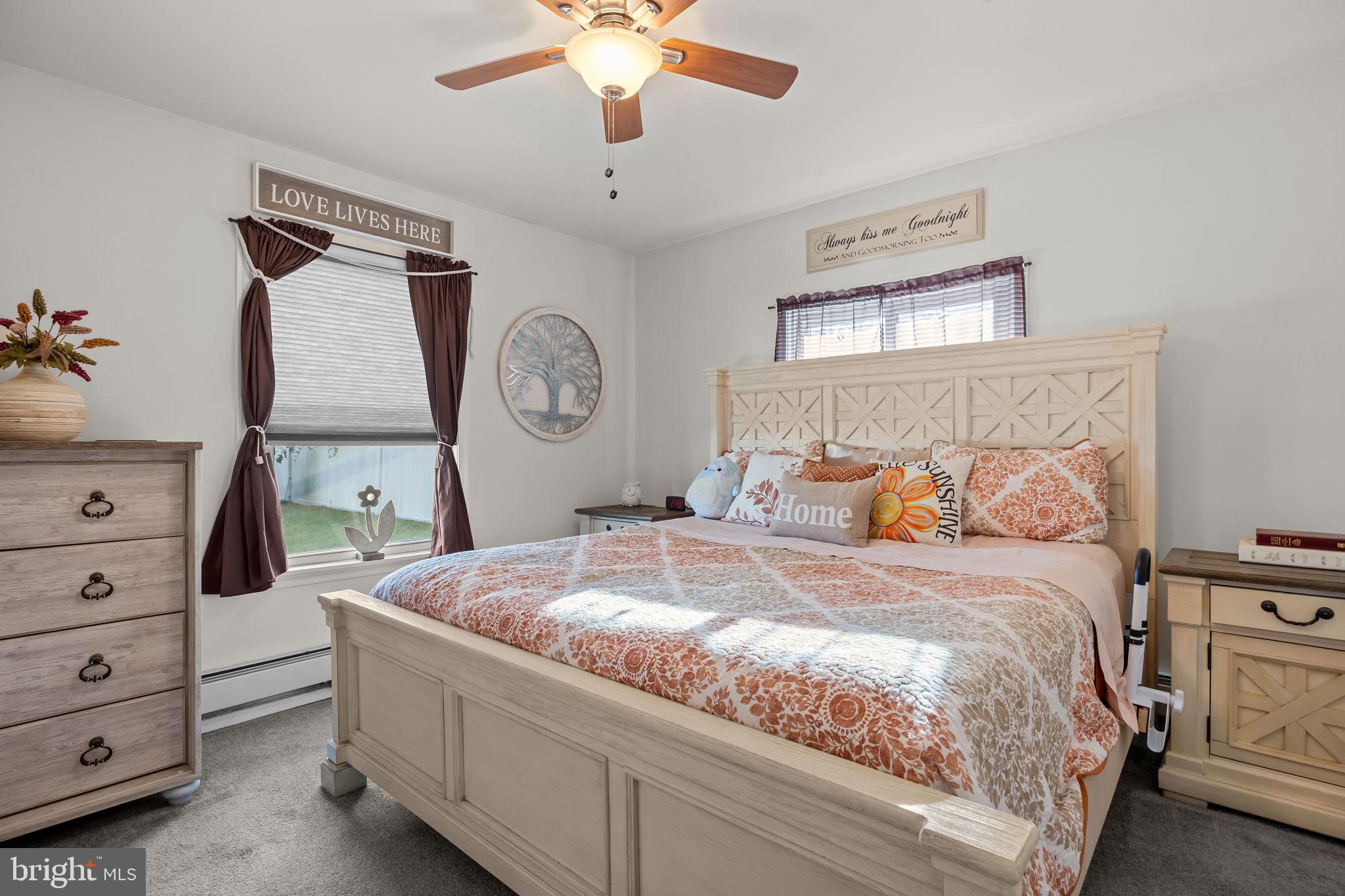 179 Crabtree Drive Levittown, PA 19055 - Photo 19 of 25 a bedroom with a bed and a chandelier