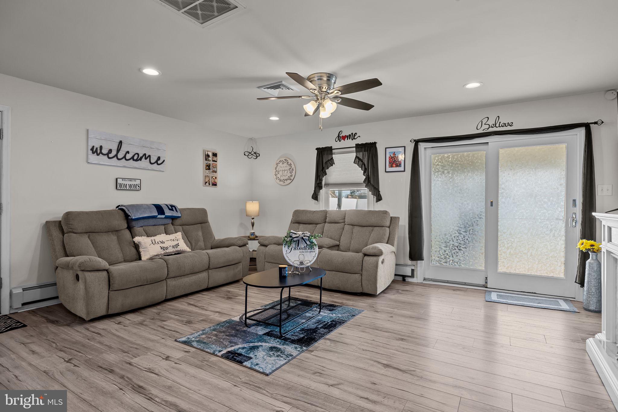 179 Crabtree Drive Levittown, PA 19055 - Photo 10 of 25 a living room with furniture and a wooden floor
