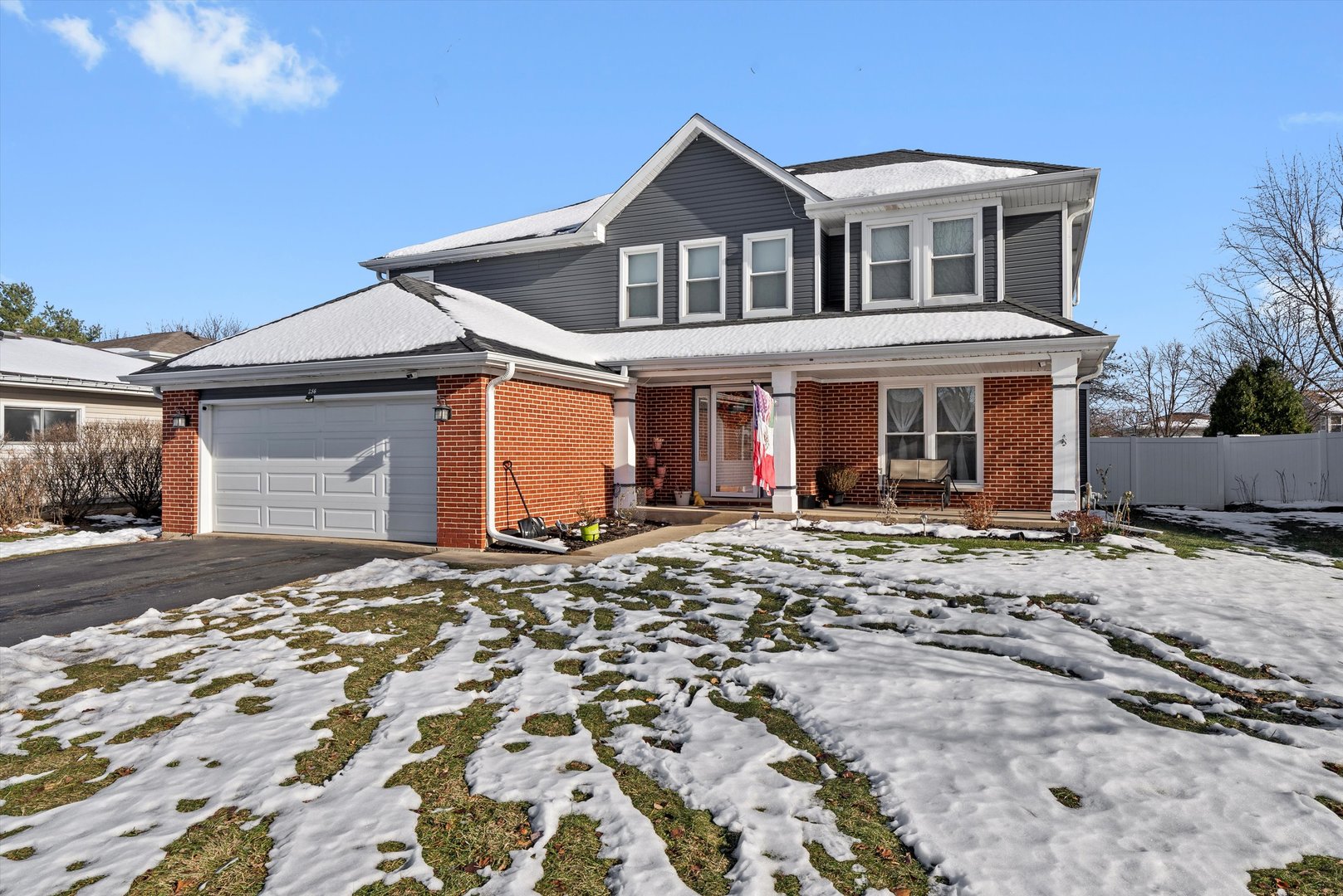 258 Silverado Street Bolingbrook, IL 60490 - Photo 2 of 31 a front view of a house with a garden