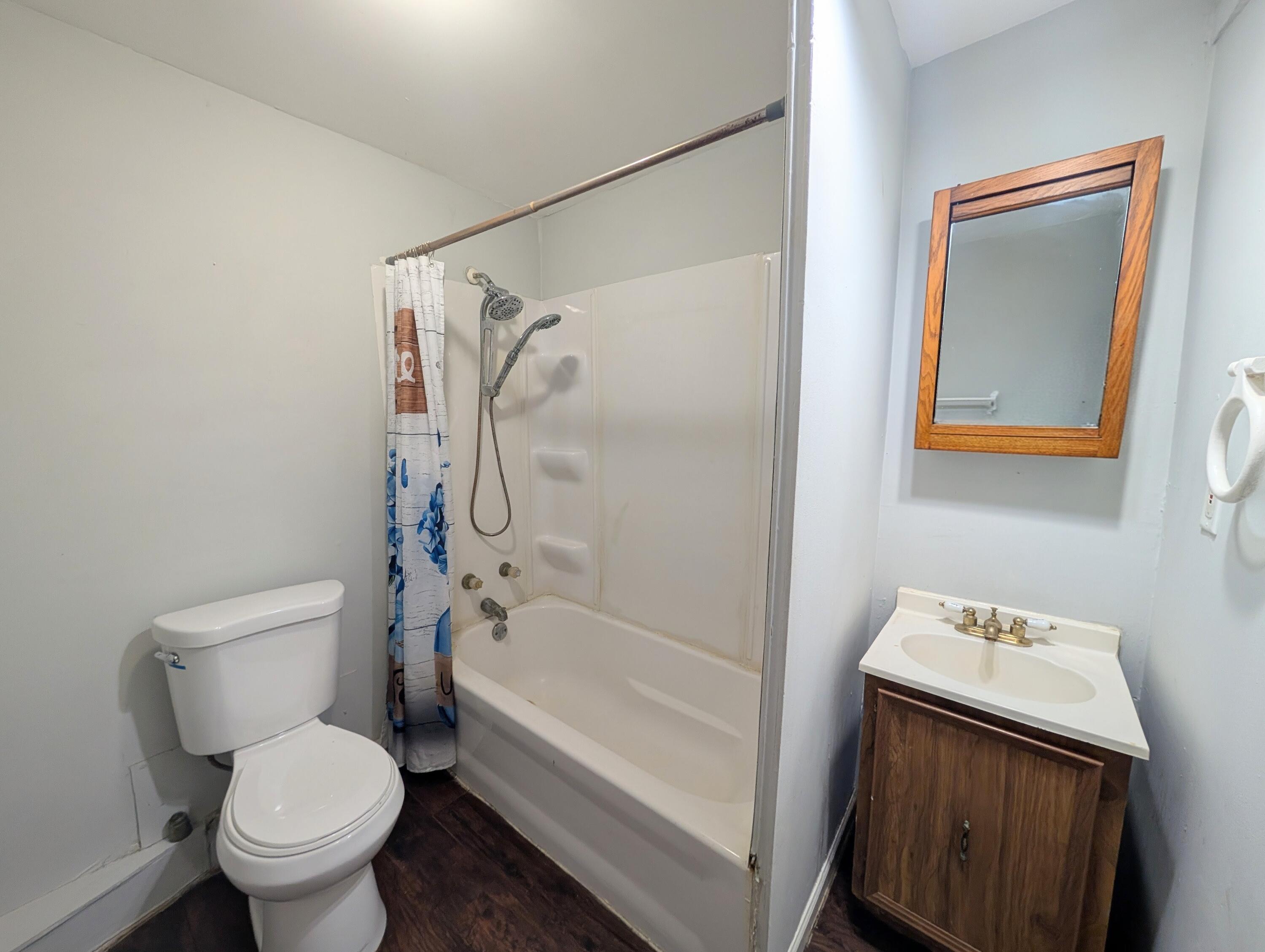 1910 South Calhoun Street Griffith, IN 46319 - Photo 12 of 19 a bathroom with a toilet and a bathtub