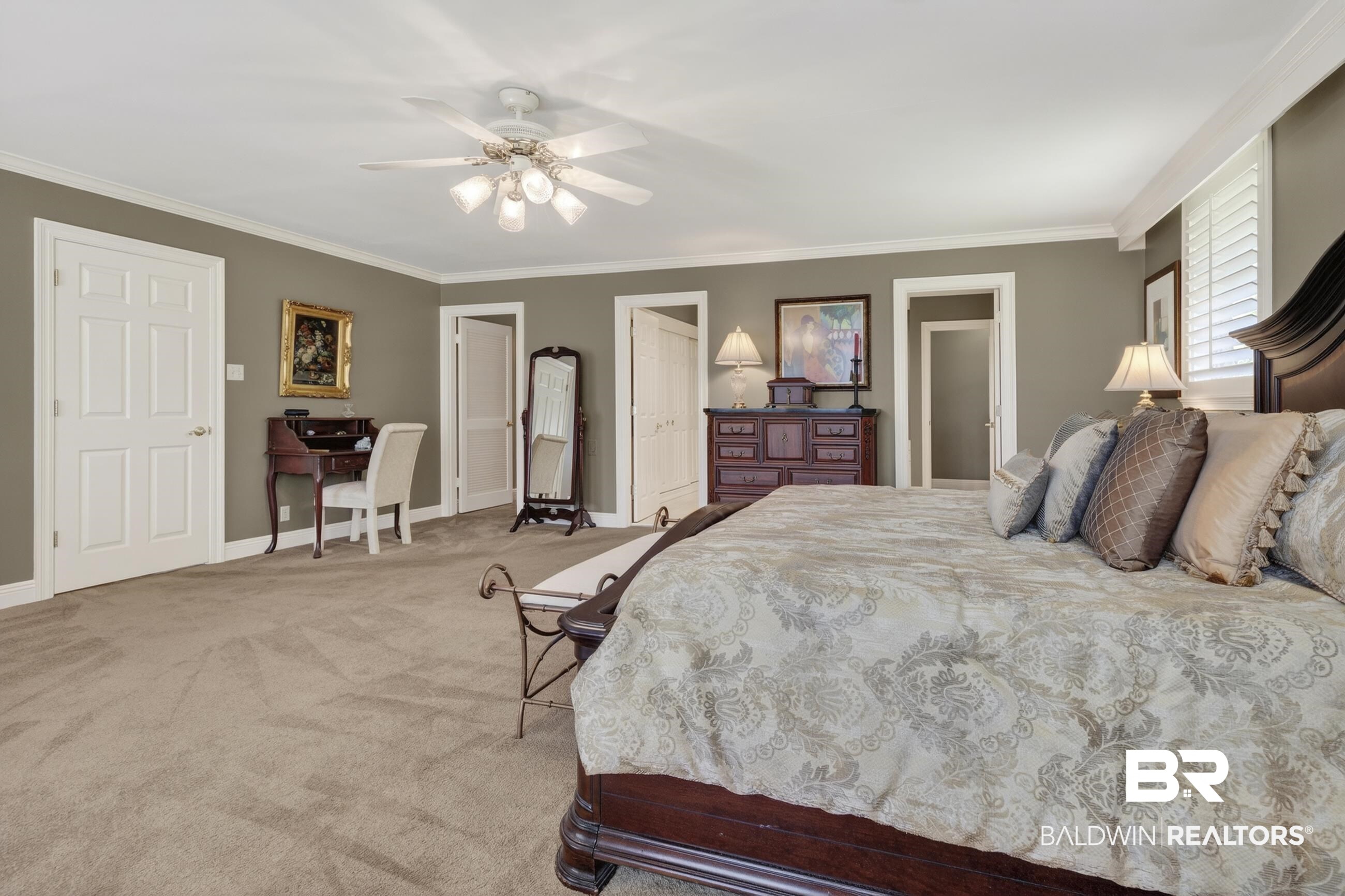 3175 Dawes Lake Road Mobile, AL 36619 - Photo 15 of 92 Bedroom featuring crown molding, light carpet, ceiling fan, and two closets