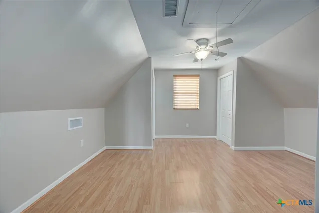 a view of balcony with wooden floor