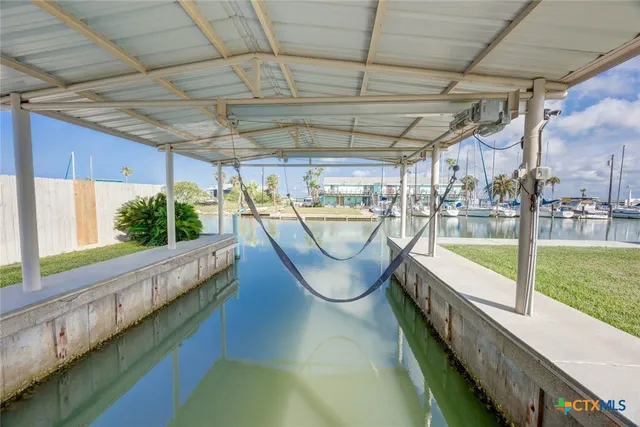 a view of swimming pool with an outdoor seating