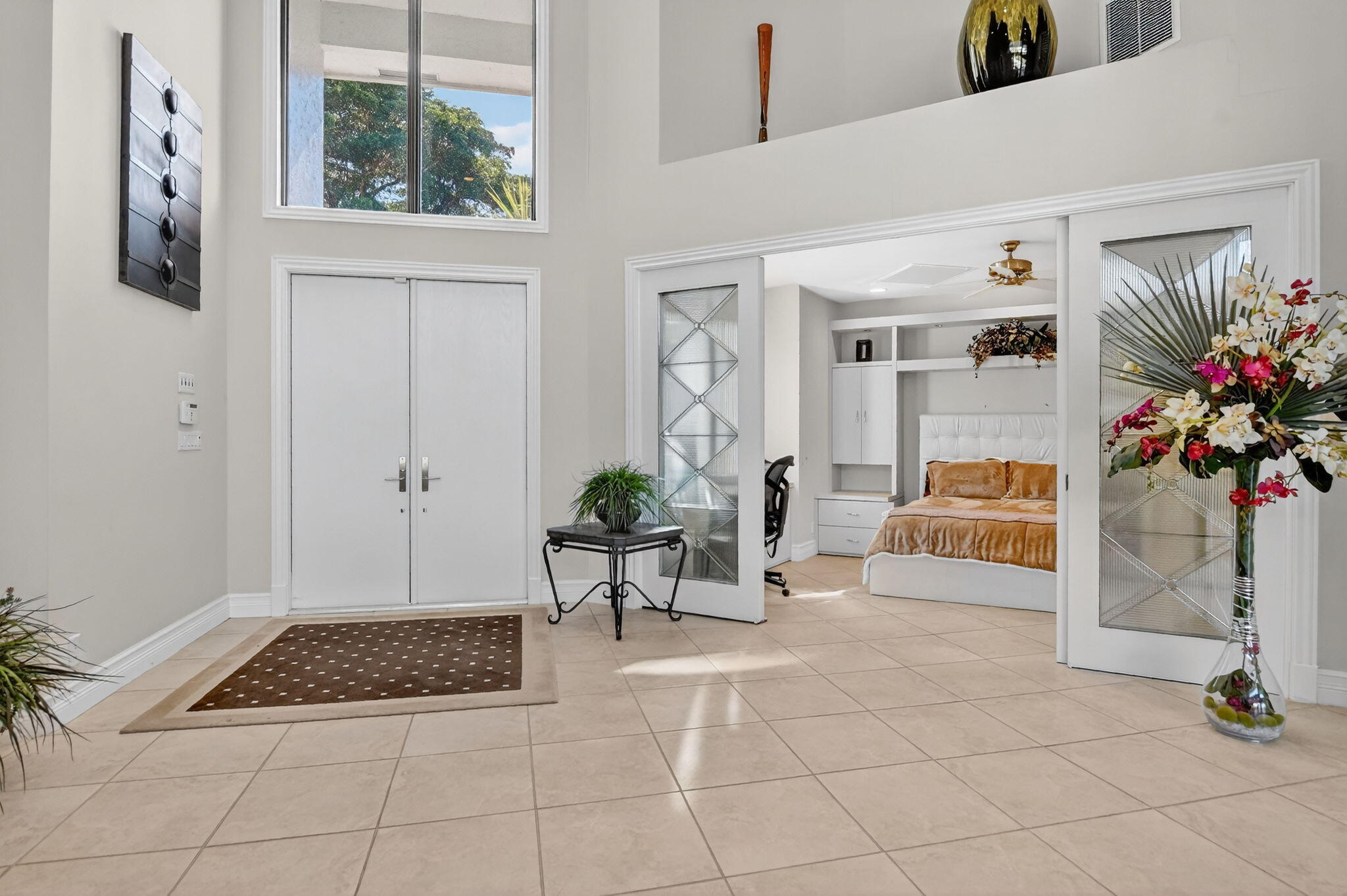 7567 Rexford Road Boca Raton, FL 33434 - Photo 11 of 95 a living room with furniture and a potted plant