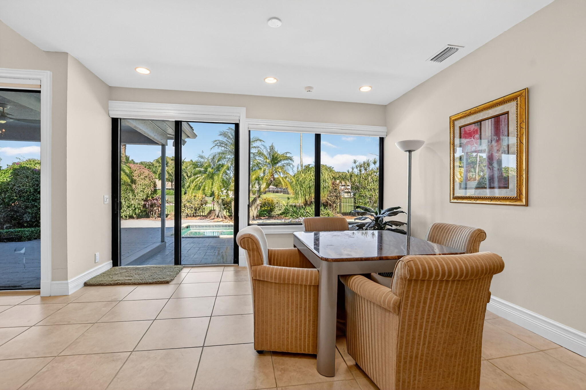 7567 Rexford Road Boca Raton, FL 33434 - Photo 13 of 95 a living room with furniture and large windows