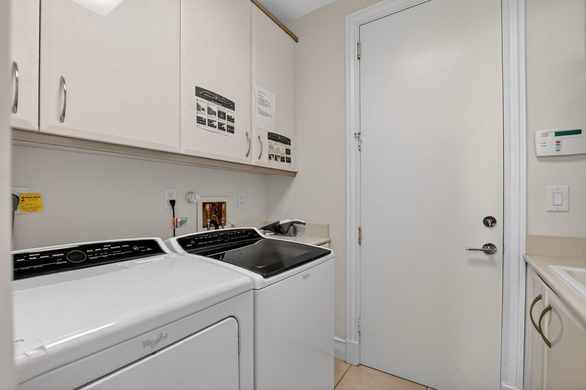 7567 Rexford Road Boca Raton, FL 33434 - Photo 24 of 95 a view of a storage and utility room with washer and dryer