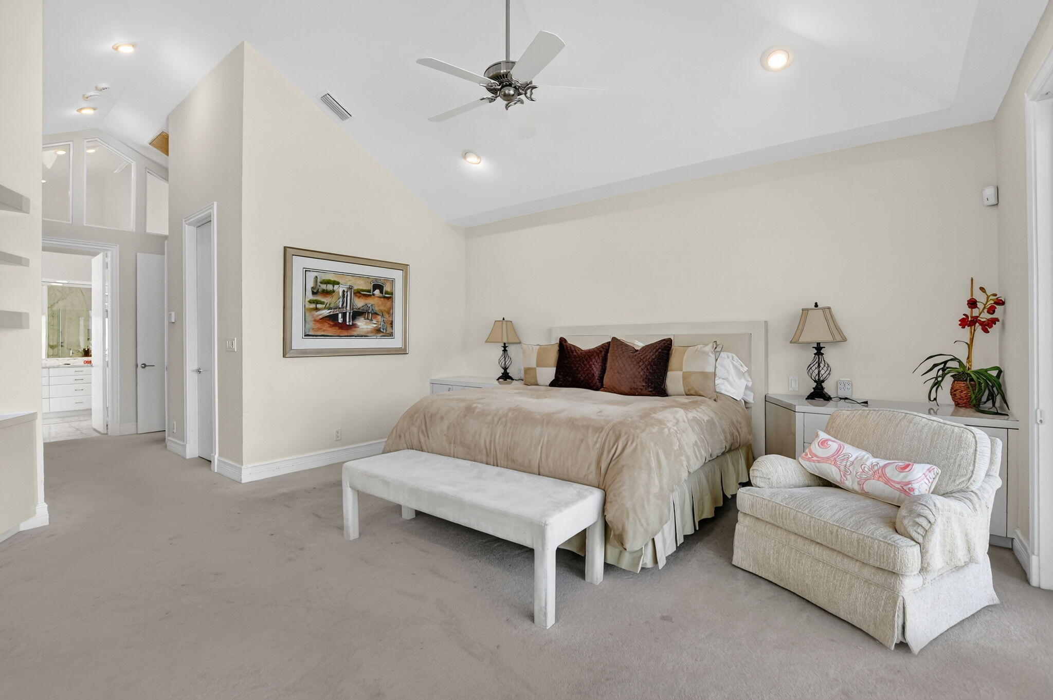 7567 Rexford Road Boca Raton, FL 33434 - Photo 29 of 95 a bedroom with a bed and a chandelier