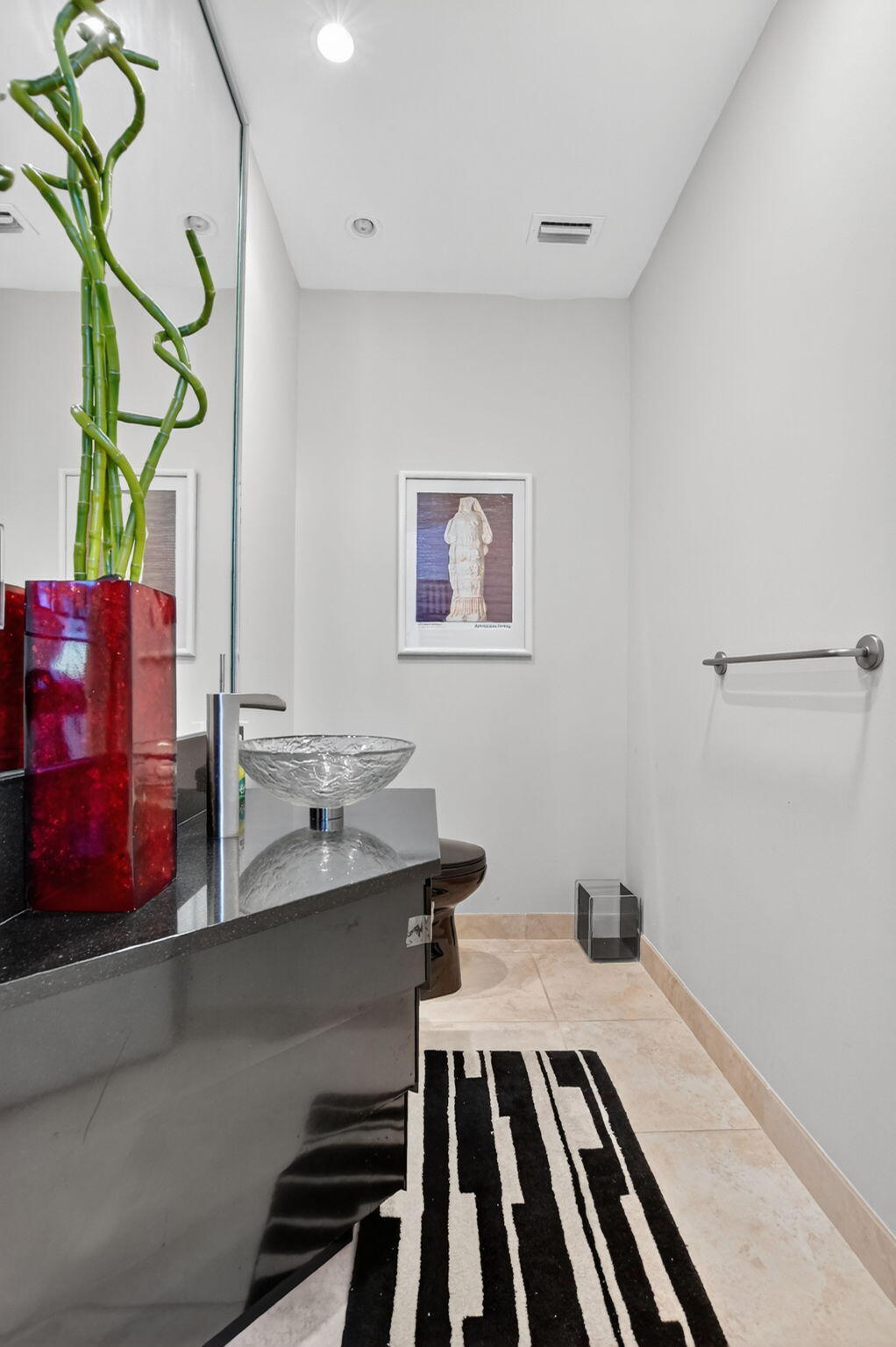 7567 Rexford Road Boca Raton, FL 33434 - Photo 36 of 95 a bathroom with a sink and a mirror