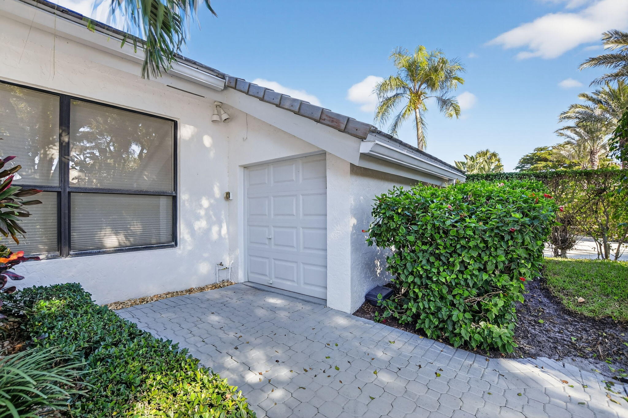 7567 Rexford Road Boca Raton, FL 33434 - Photo 61 of 95 a front view of a house with a yard
