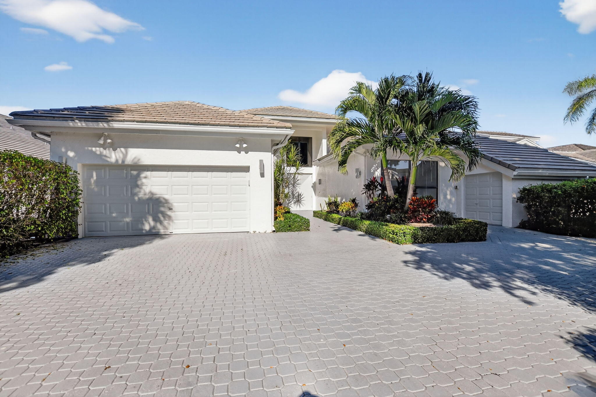 7567 Rexford Road Boca Raton, FL 33434 - Photo 63 of 95 a front view of a house with a yard and a garage