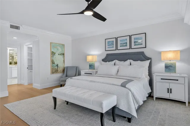 a spacious bedroom with a bed and a couch