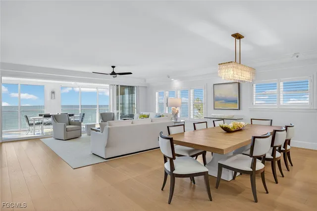 a dining room with furniture window and outside view