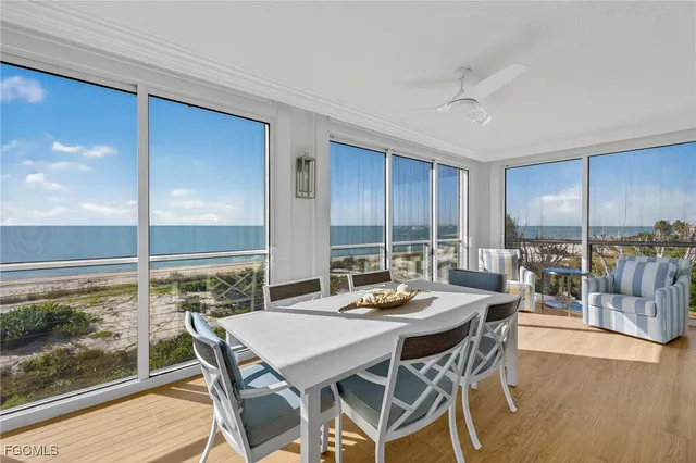 a view of a dining room with furniture window and wooden floor