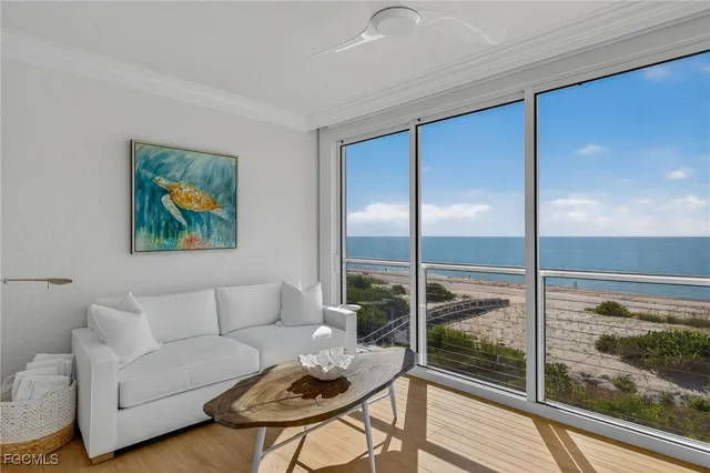 a view of a balcony with table and chairs