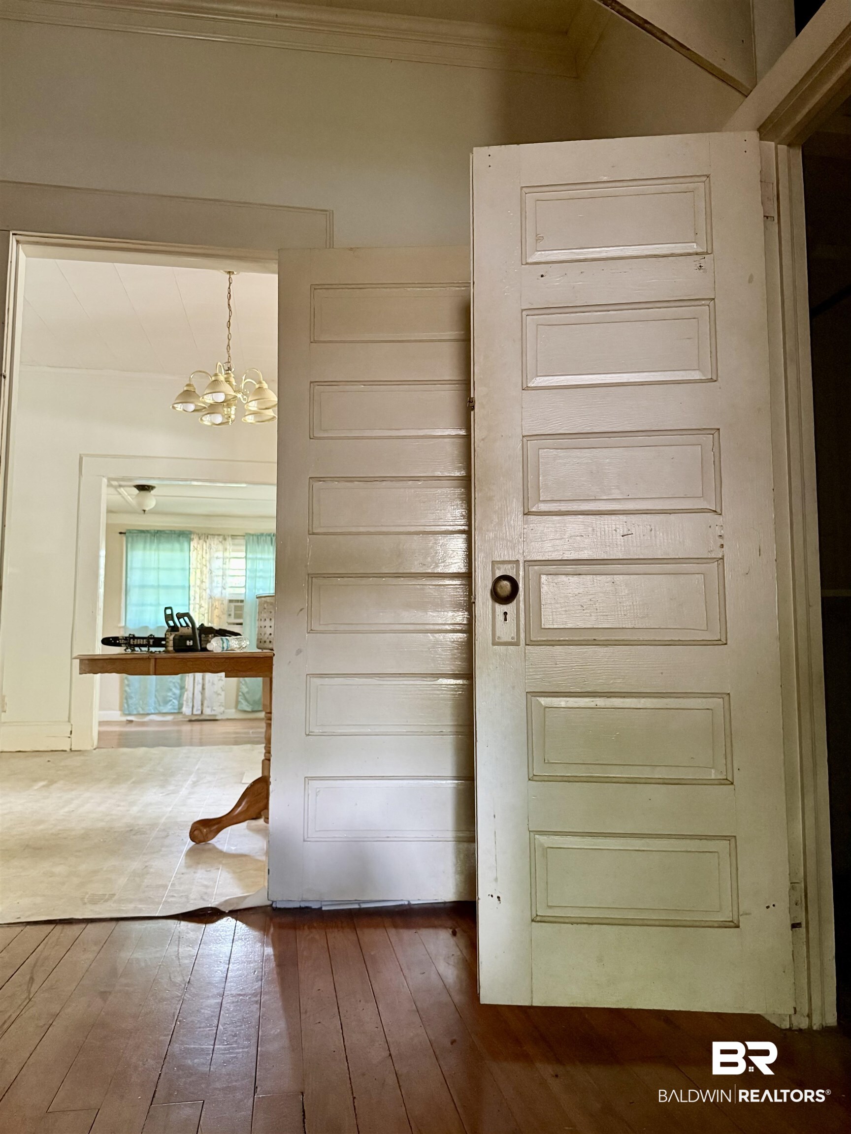 610 Alco Drive Brewton, AL 36426 - Photo 17 of 18 Entryway with a chandelier, crown molding, and wood-type flooring