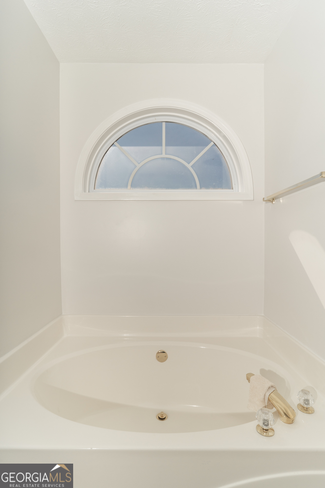 724 Teamon Road Griffin, GA 30223 - Photo 38 of 50 a close up of a bathtub in a bathroom