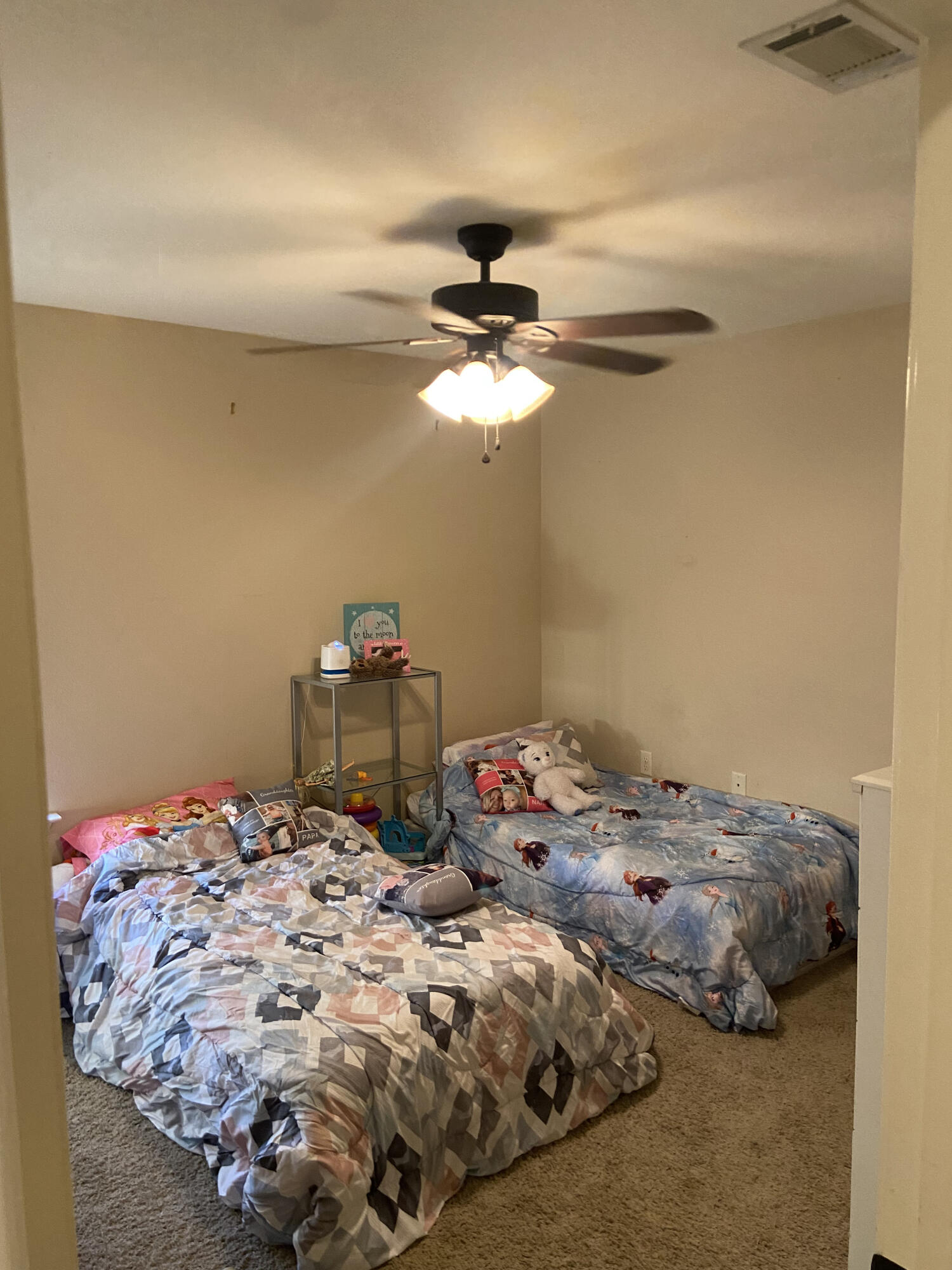 516 Grand Ridge Drive Crestview, FL 32539 - Photo 16 of 30 a bedroom with a bed and a chandelier