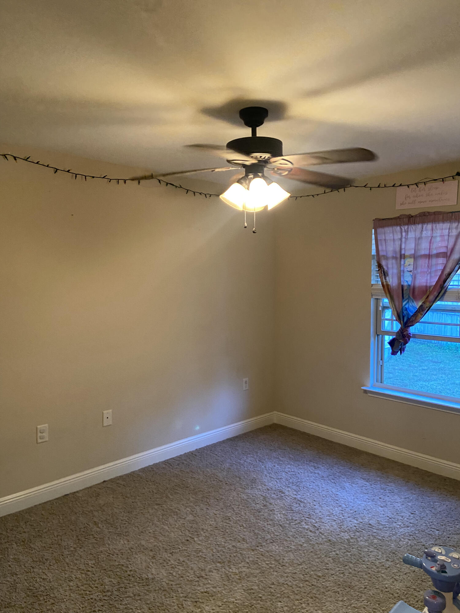 516 Grand Ridge Drive Crestview, FL 32539 - Photo 18 of 30 a view of a room with an empty space and a window
