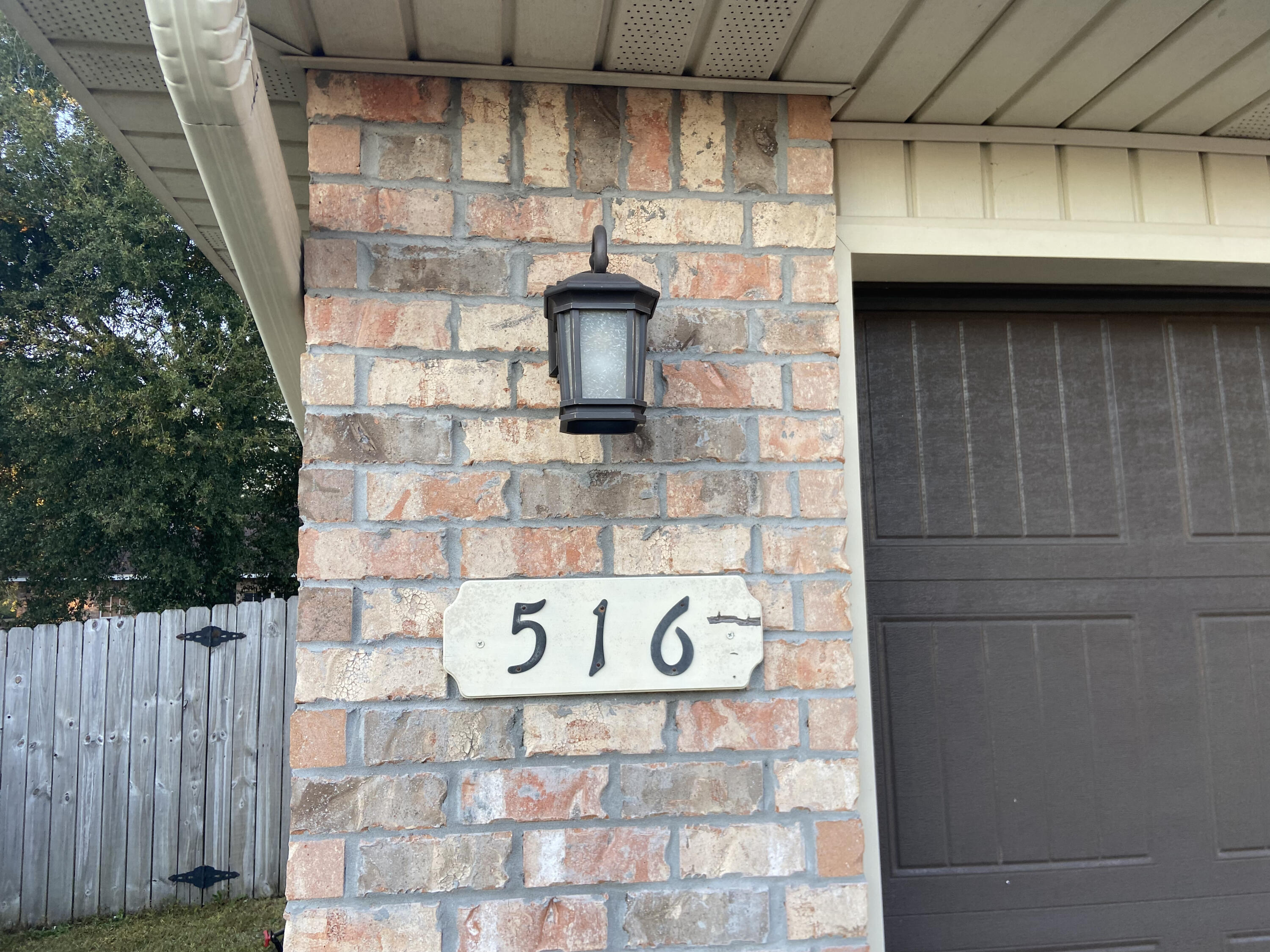 516 Grand Ridge Drive Crestview, FL 32539 - Photo 2 of 30 a brick building with a street sign on it