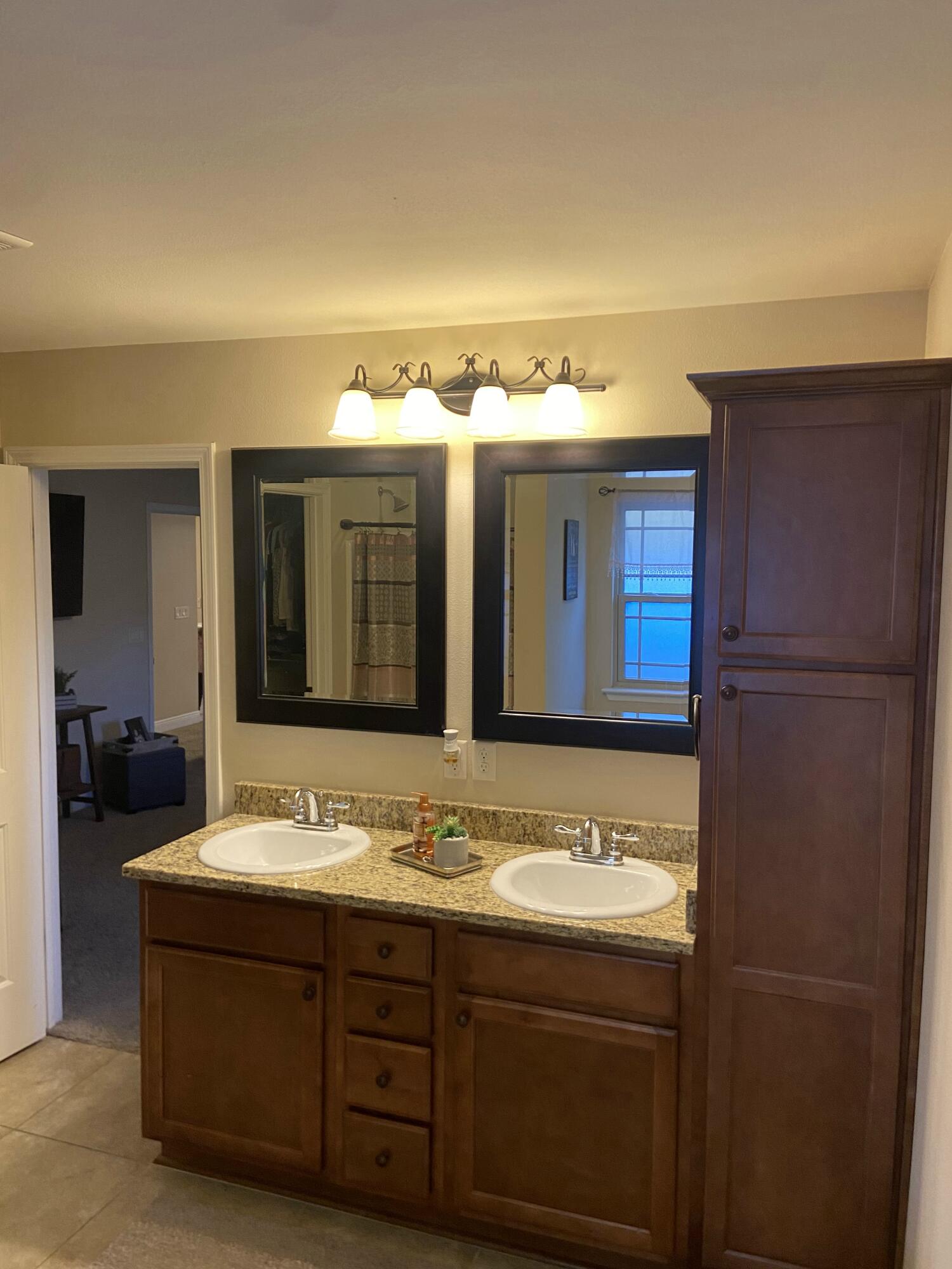 516 Grand Ridge Drive Crestview, FL 32539 - Photo 23 of 30 a bathroom with a sink and a mirror