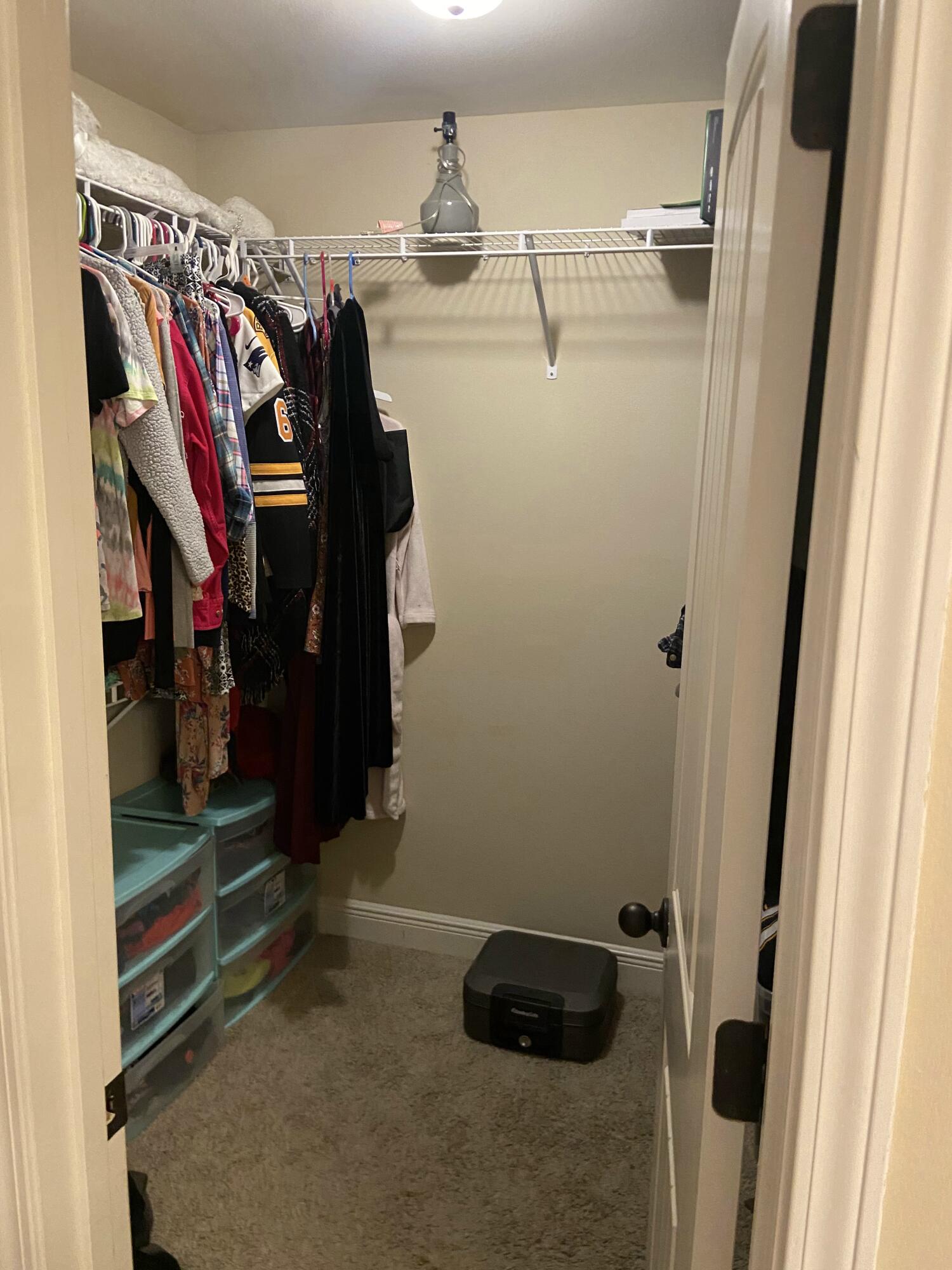 516 Grand Ridge Drive Crestview, FL 32539 - Photo 27 of 30 a view of walk in closet with clothes and shoes