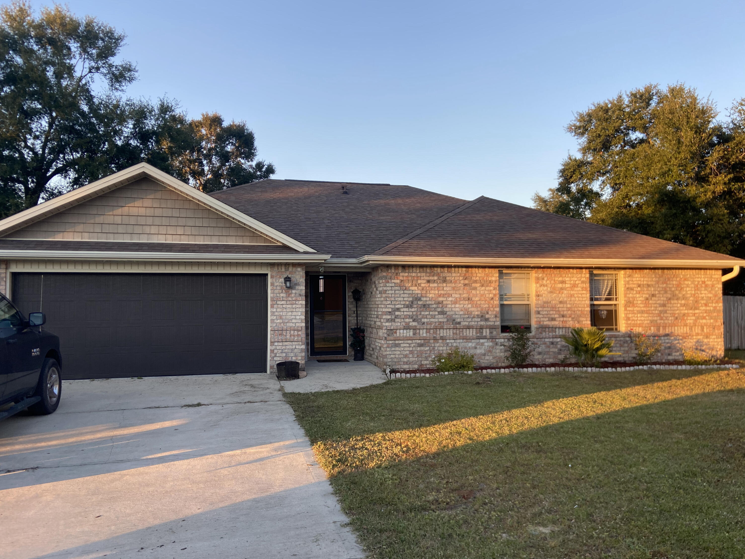 516 Grand Ridge Drive Crestview, FL 32539 - Photo 3 of 30 a front view of a house with a yard and garage