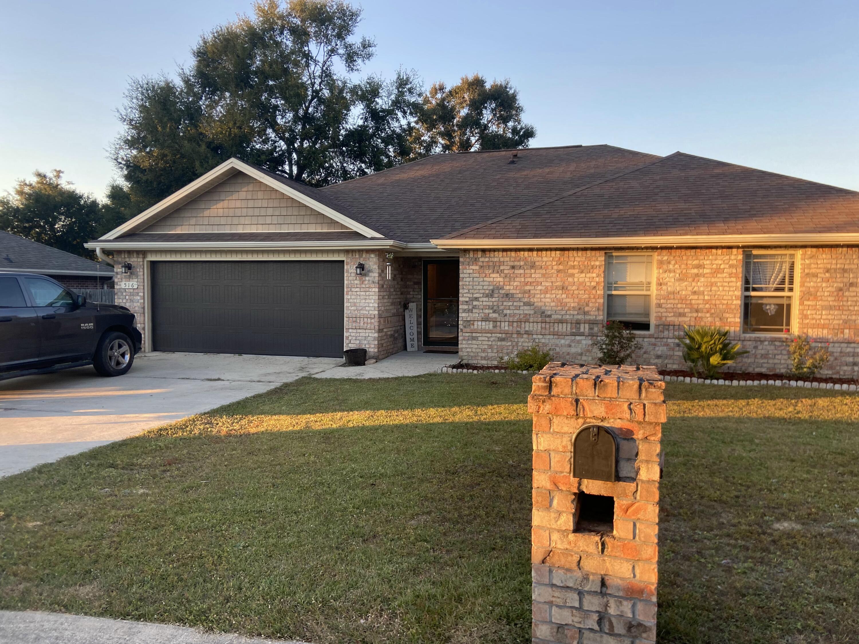 516 Grand Ridge Drive Crestview, FL 32539 - Photo 5 of 30 a front view of a house with a yard
