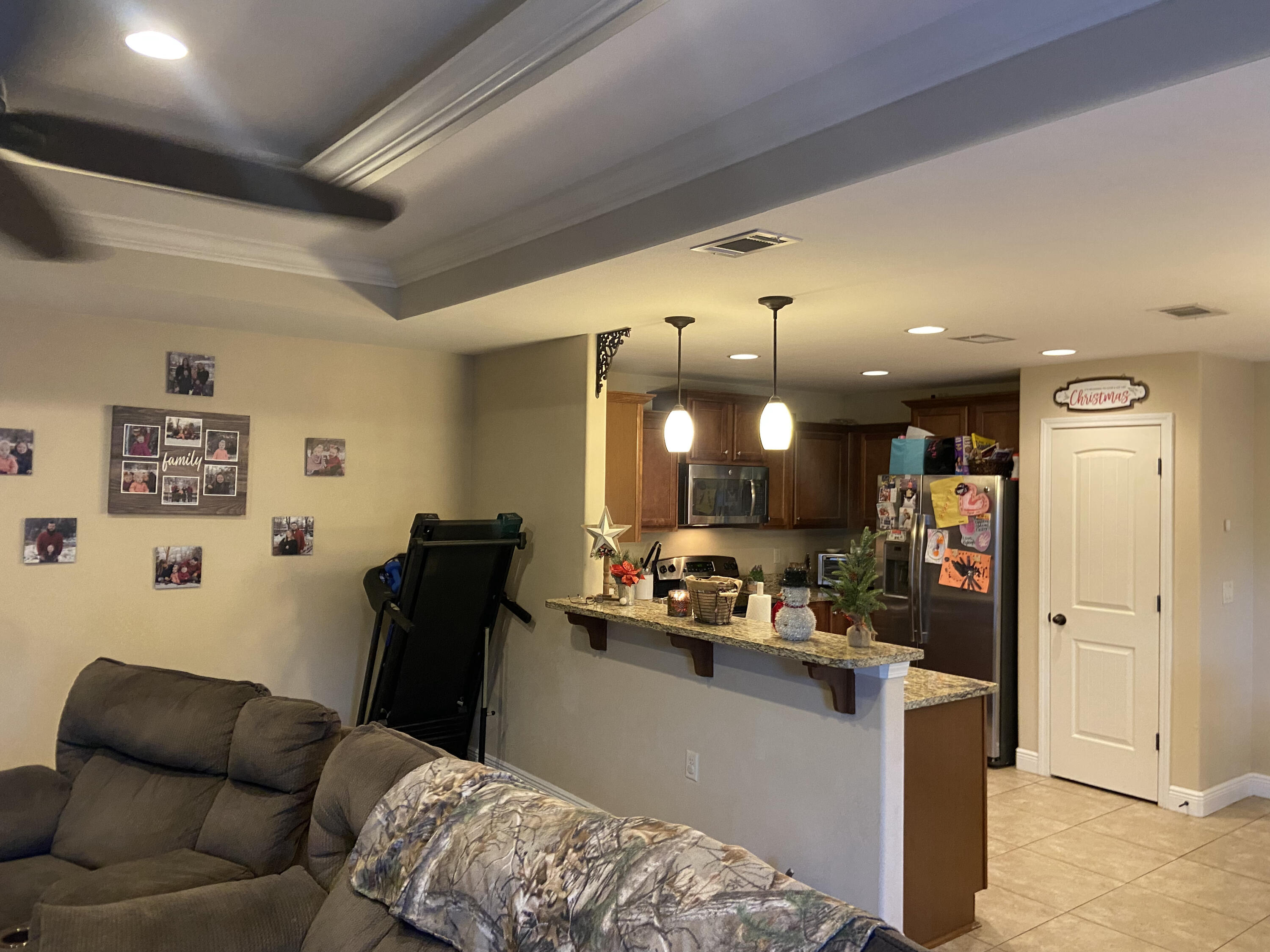 516 Grand Ridge Drive Crestview, FL 32539 - Photo 8 of 30 a living room with furniture and a flat screen tv