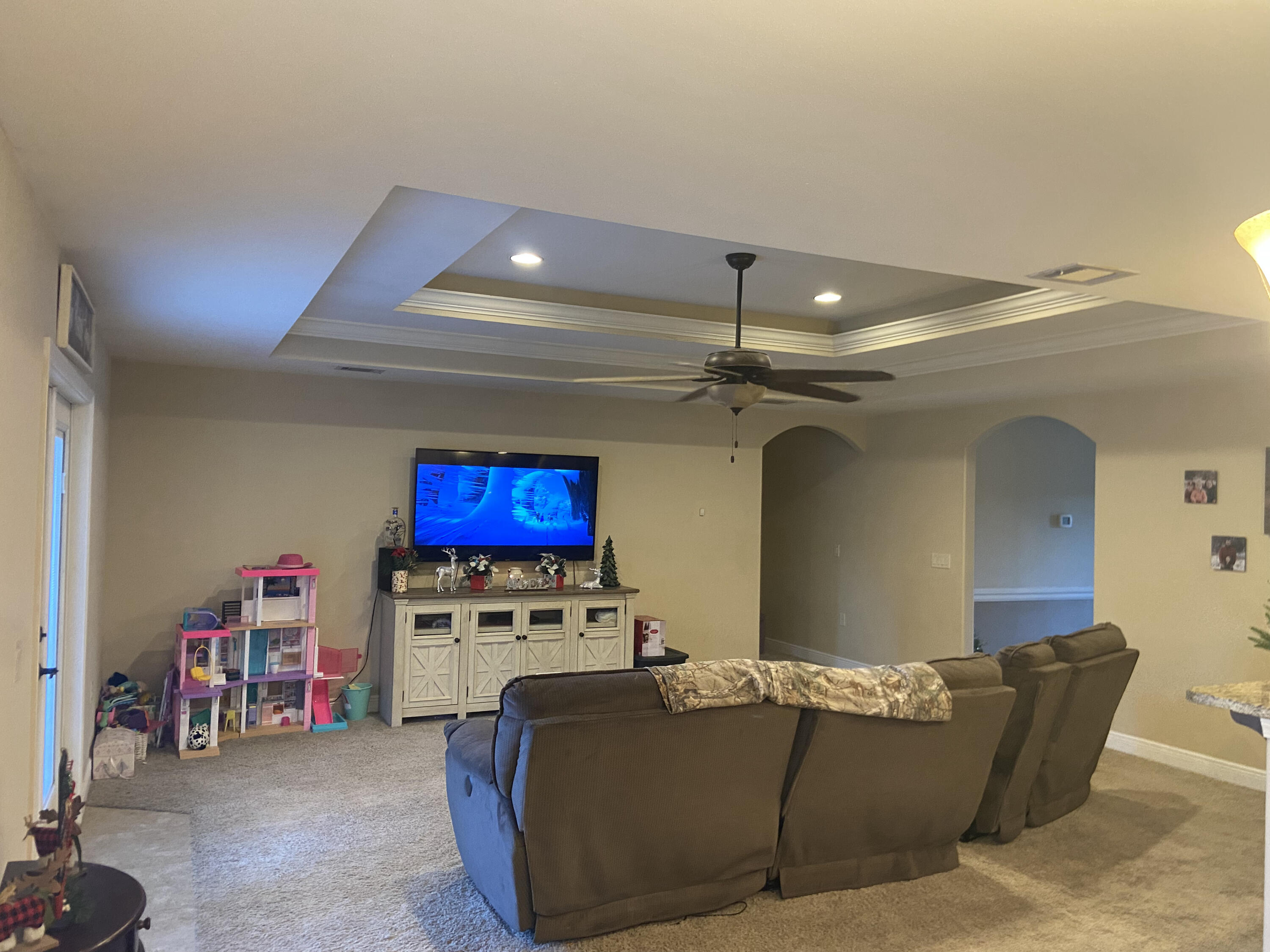 516 Grand Ridge Drive Crestview, FL 32539 - Photo 10 of 30 a living room with furniture and a flat screen tv